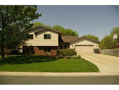 Welcome home to 8931 Zinna Ln N!