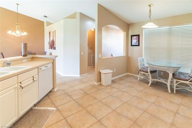 Kitchen with hanging light fixtures, dishwasher, a