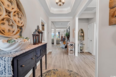 Foyer entrance with visible vents, baseboards, cro