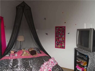 One of the 3 upstairs bedrooms
