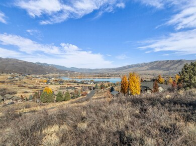View of mountain backdrop featuring a large body of water