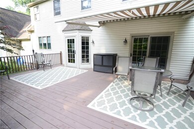Deck on back of home with retractable awning
