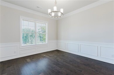 Unfurnished room with ornamental molding, a notabl
