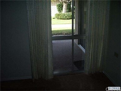 Window in Master bdrm looks across patio to pleasa