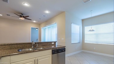 Kitchen with white cabinetry, stainless steel appl