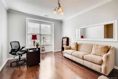 Exquisite hard wood floors adorn this formal livin