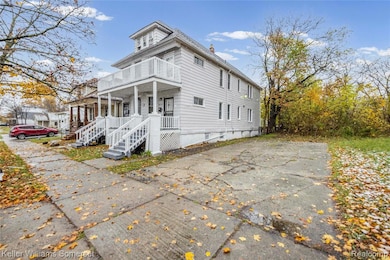 View of front facade featuring a porch and a balcony