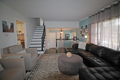 Picture window, stairs to upper level