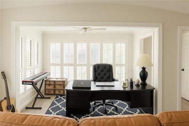Office area with light wood-type flooring, ceiling