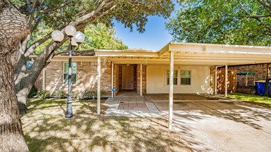 View of front of house with a carport