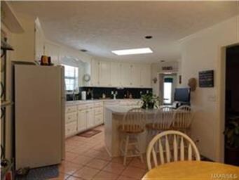 Large space. Bar stools remain.