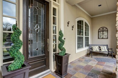 Enjoy your morning coffee on this spacious front porch.