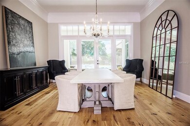 French doors reveal a lovely pool view through the