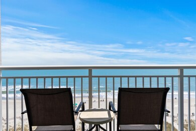 Balcony with a view of the beach and a water view