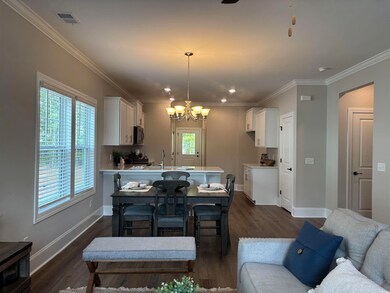 Living area with plenty of natural light, a chande