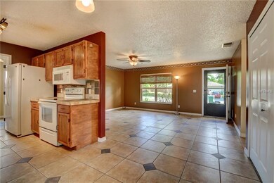 view from Dining Room into Living Room/Kitchen