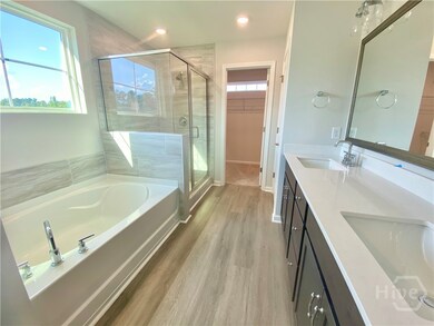 Primary bathroom with tiled separate shower & tub,