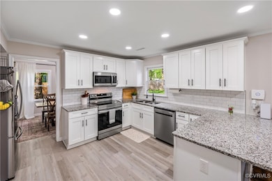 Kitchen with appliances with stainless steel finis