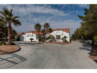 Facade/Exterior Front. Circular drive way with ele