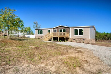 Back of property with a deck