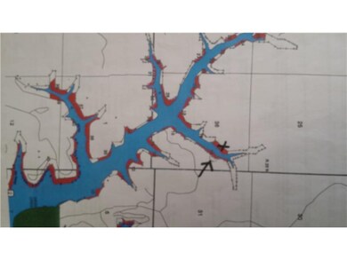 Exterior Front. Arrow points out location of lot,