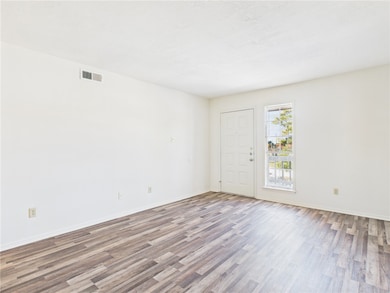 Empty room with wood finished floors