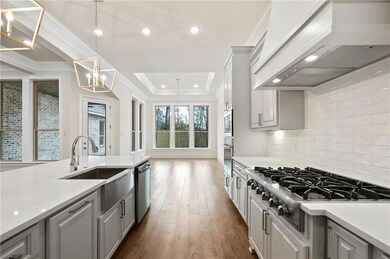 Kitchen has extra wide space between wall cabinets
