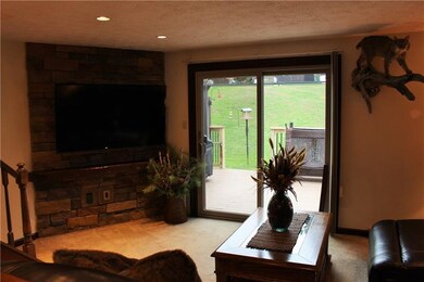 Stone feature wall and wood mantel to anchor your 