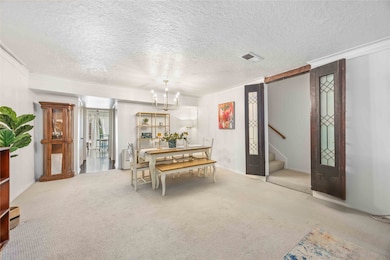 Dining area leads into the kitchen for effortless serving and conversation