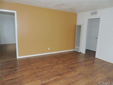 Kitchen and hallway off of living room.