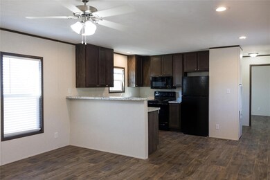 Kitchen with a wealth of natural light, dark wood-