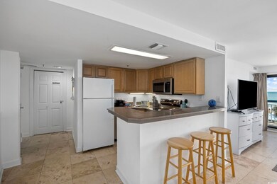 Kitchen with kitchen peninsula, appliances with st