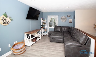 Living room feature new vinyl plank flooring.