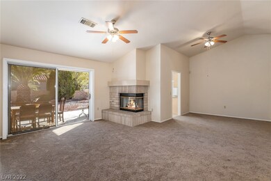 Large living room / dining room with gas brick fir