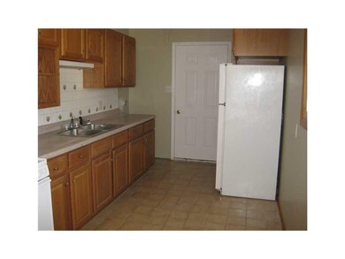 Kitchen. Tile floor and backsplash; newer cabinets