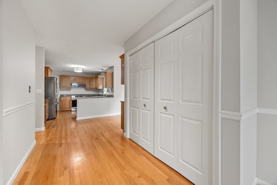 large storage and coat closets located just off the kitchen
