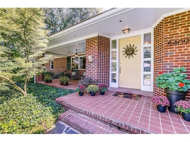 Mid Century Modern entryway with large porch, and 