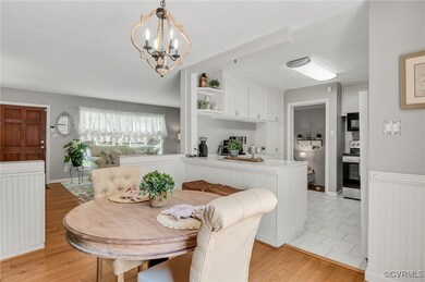 Dining area with a chandelier, light wood finished
