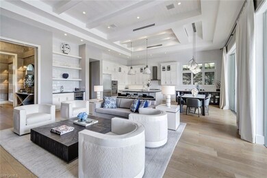 Living room featuring an inviting chandelier, a ra