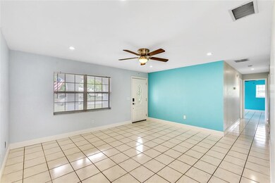 Family room showing the front door and hall way le