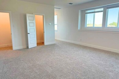 Unfurnished bedroom featuring light carpet
