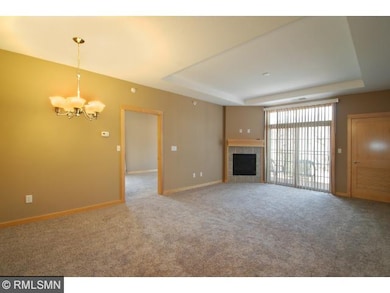 Spacious living area with gas fireplace and brand 