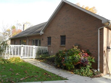 REAR VIEW OF HOME WITH FENCED PATIO