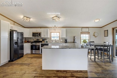 Kitchen featuring appliances with stainless steel 