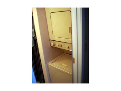 Unit can hold a stackable washer & dryer.  Now tha