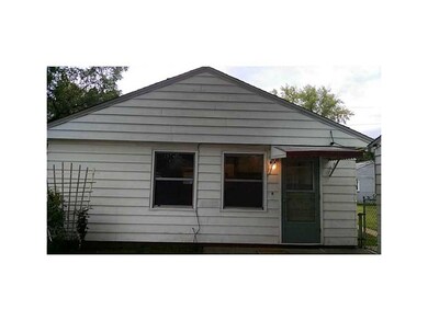 Front Exterior. Rose bush to the left blooms.