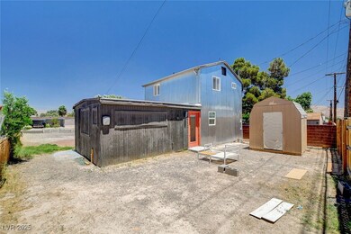 View of shed with a fenced backyard