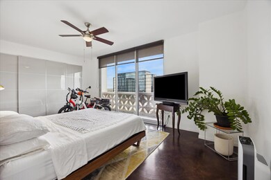 Bedroom with floor to ceiling windows and a ceili