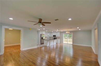 Family room looking front to back into kitchen and