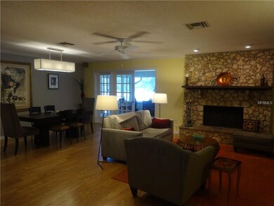 Open floor plan with wood burning fireplace and la